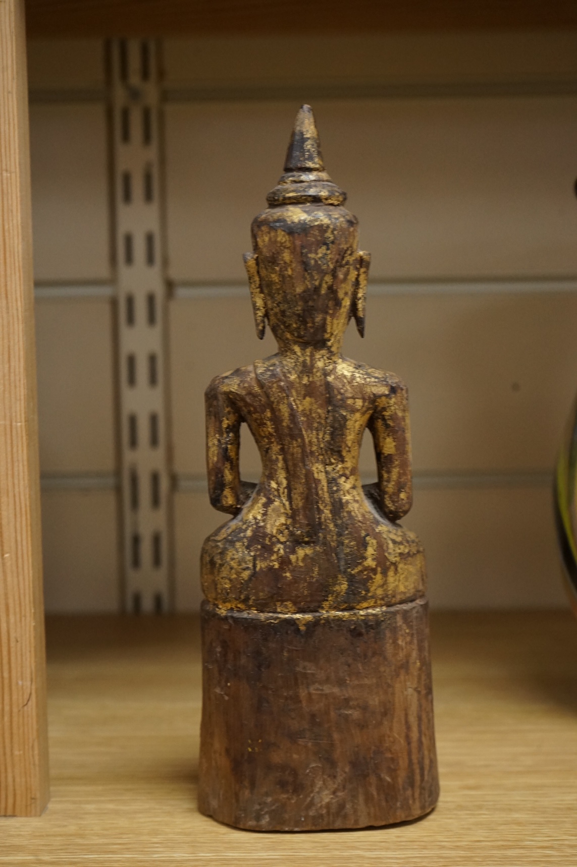 A Burmese giltwood figure of seated Buddha, 24cm high